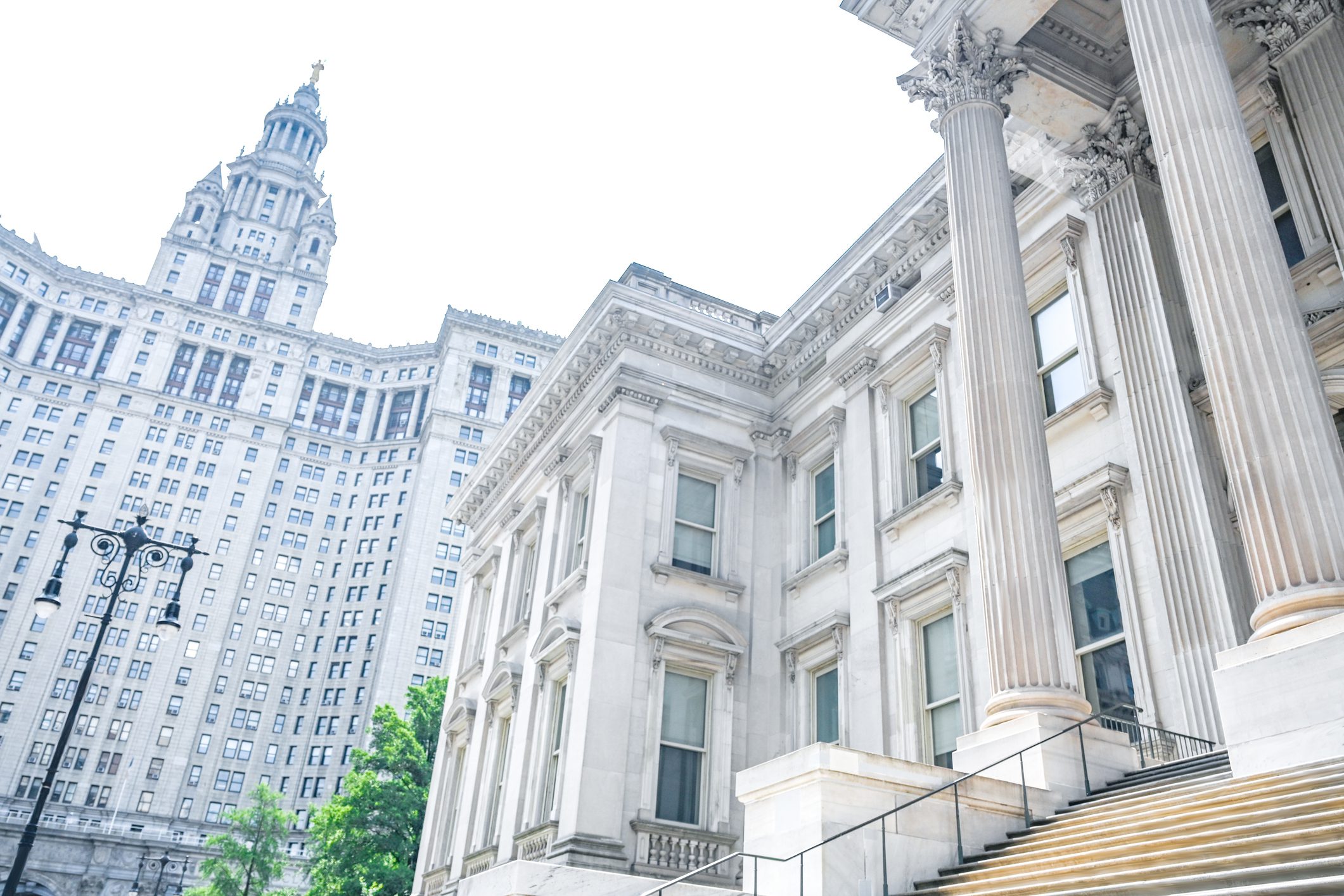 Historic buildings with columns and ornate architecture.