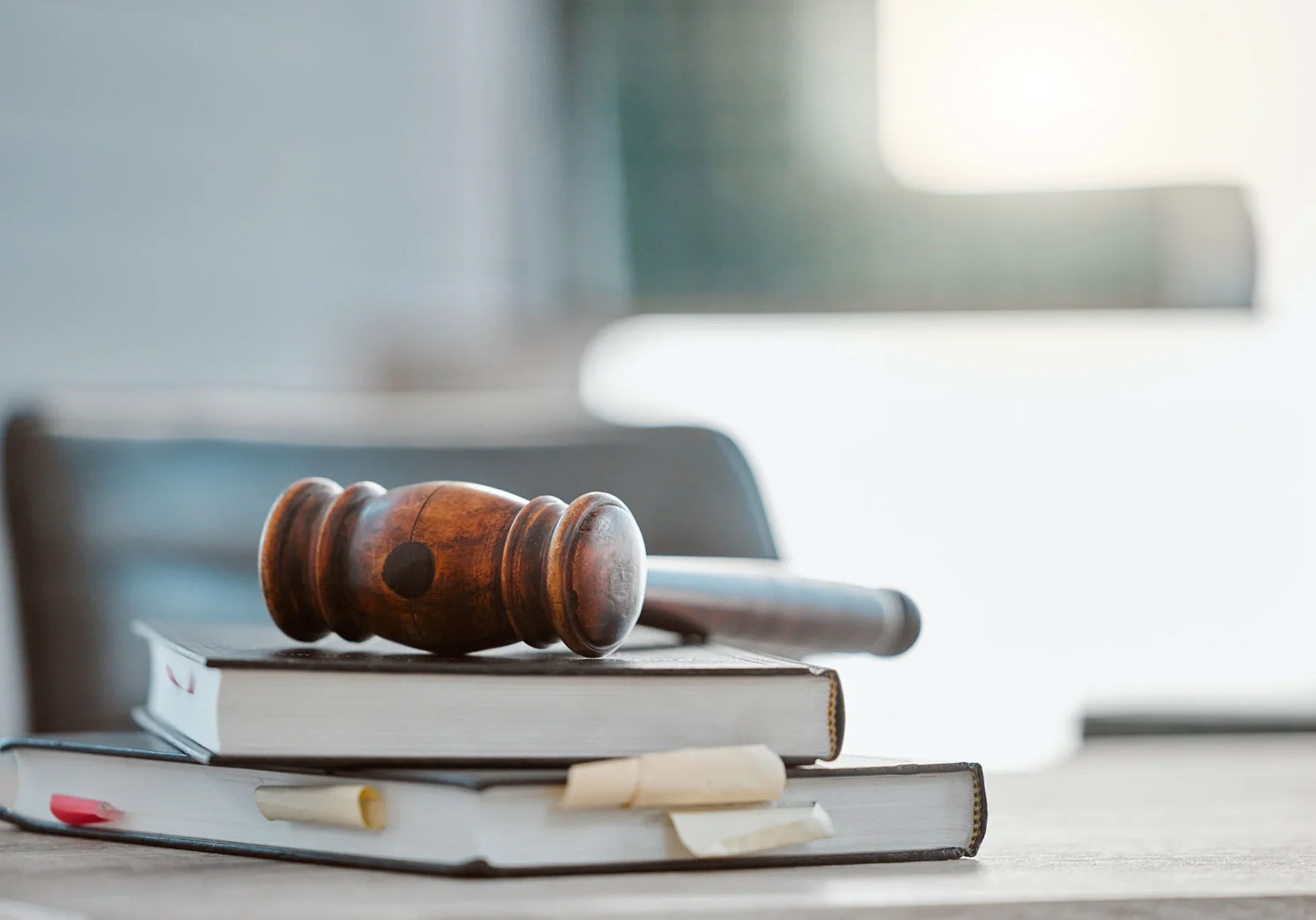 Gavel resting on stacked law books.
